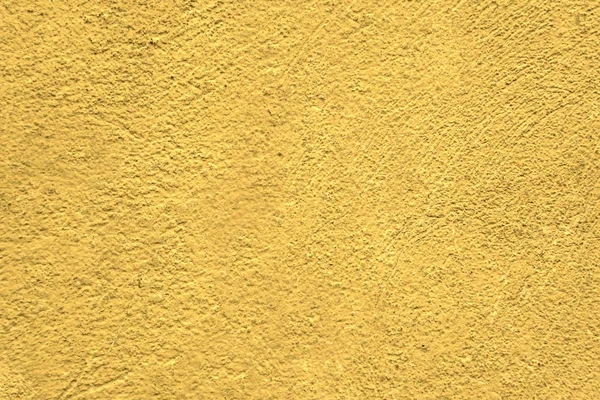 A wall with a rough surface is painted in lemon color — Stock Photo, Image
