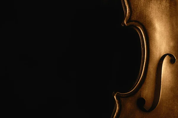 Half of a violin on a black background — Stock Photo, Image