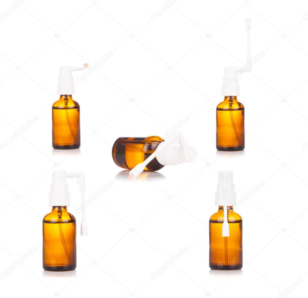 Pharmacy. Throat spray medication in glass bottle isolated on wh