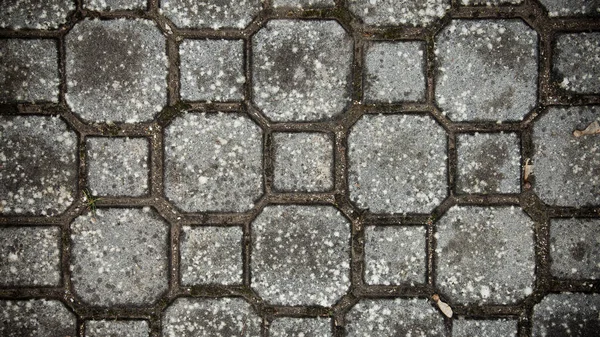 Textura pavimento de piedra. Granito adoquinado pavimento fondo. Fondo abstracto del antiguo primer plano del pavimento de adoquines. Texture.in oman sin costura pavimento abstracto en la antigua calle — Foto de Stock