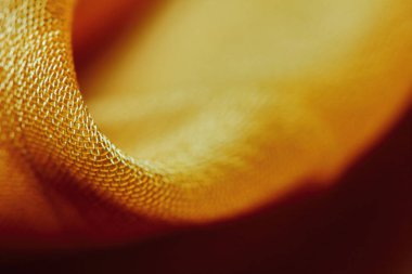 Arka plan için soyut makro kumaşların güzel sarı dokusu