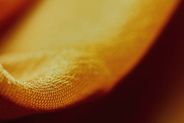 Arka plan için soyut makro kumaşların güzel sarı dokusu