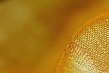 Arka plan için soyut makro kumaşların güzel sarı dokusu