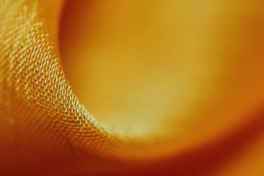 Arka plan için soyut makro kumaşların güzel sarı dokusu