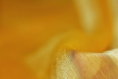 Arka plan için soyut makro kumaşların güzel sarı dokusu