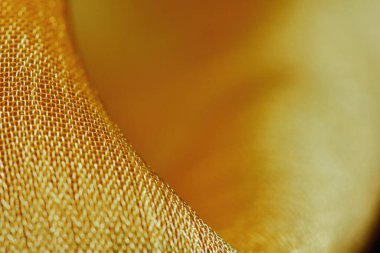 Arka plan için soyut makro kumaşların güzel sarı dokusu