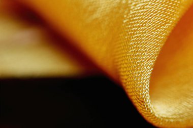 Arka plan için soyut makro kumaşların güzel sarı dokusu