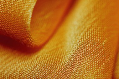 Arka plan için soyut makro kumaşların güzel sarı dokusu