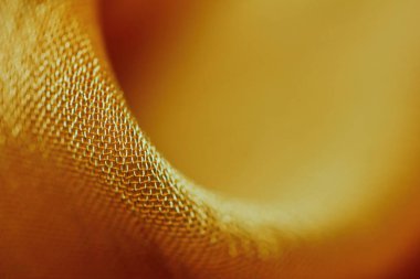 Arka plan için soyut makro kumaşların güzel sarı dokusu