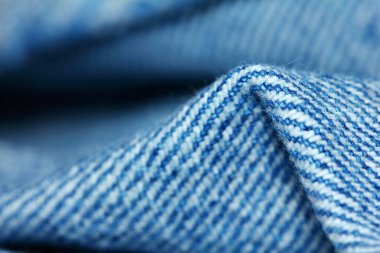 Güzel bir arkaplan için soyut makrodaki kumaşın güzel mavi dokusu