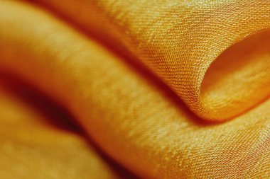 Arka plan için soyut makro kumaşların güzel sarı dokusu