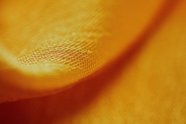 Arka plan için soyut makro kumaşların güzel sarı dokusu