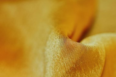 Arka plan için soyut makro kumaşların güzel sarı dokusu