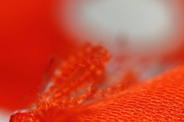arkaplan için soyut makrodaki kumaşın güzel kırmızı dokusu