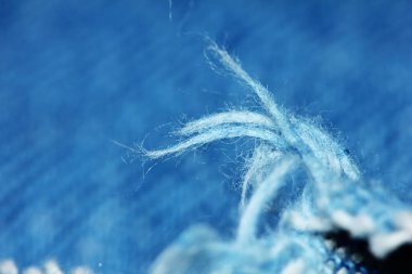 Güzel bir arkaplan için soyut makrodaki kumaşın güzel mavi dokusu