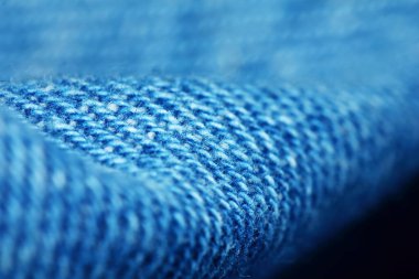 Güzel bir arkaplan için soyut makrodaki kumaşın güzel mavi dokusu