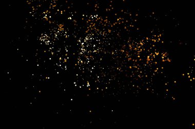 Siyah arkaplanda altın parıltılar