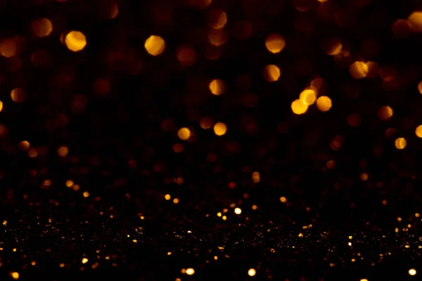 Glitter lights on black background — Stock Photo, Image