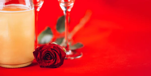 Valentines day background with champagne glasses and red rose