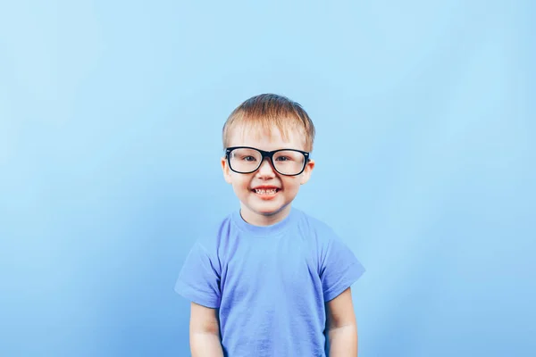 Angry small boy looking at camera in glasses — Stock Photo, Image