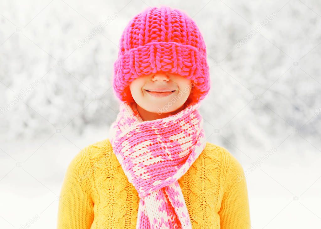 Fashion winter happy smiling woman wearing colorful knitted hat 