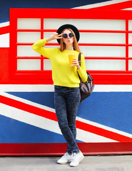 Fashion pretty cool girl with cup having fun over colorful backg — Stock Photo, Image