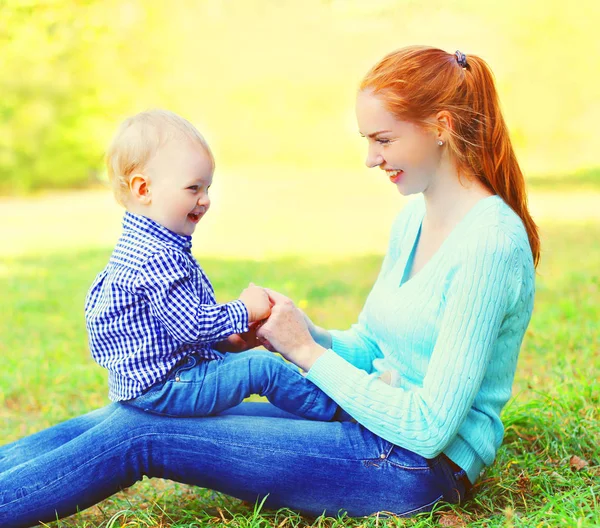 Portrait happy smiling mother and son child outdoors in a sunny — Stock Photo, Image