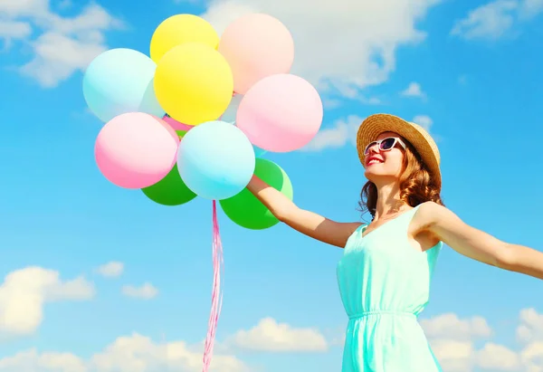 Happy young smiling woman holds an air colorful balloons is havi — Stock Photo, Image
