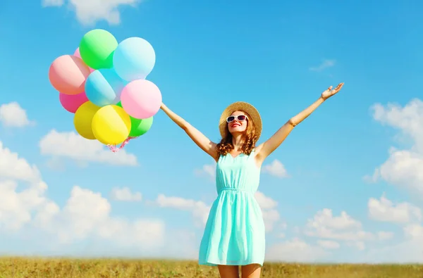 Happy young smiling woman with an air colorful balloons is enjoy — Stock Photo, Image