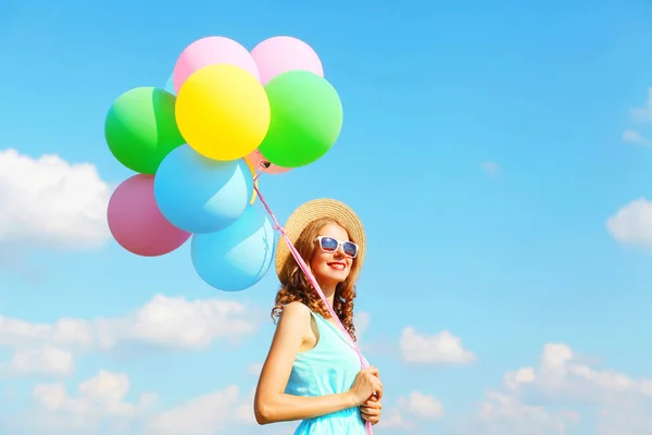 Happy young smiling woman with an air colorful balloons is havin — Stock Photo, Image