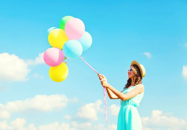 Happy young woman with an air colorful balloons is having fun we — Stock Photo, Image