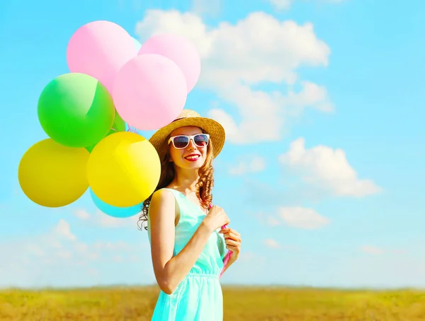 Portrait happy young smiling woman with an air colorful balloons — Stock Photo, Image