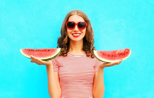 Fashion happy smiling young woman is holding slice of armelon — стоковое фото