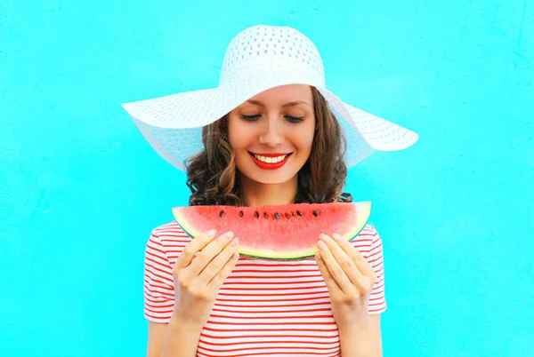 Happy smiling woman is holding a slice of watermelon in a straw — Stock Photo, Image