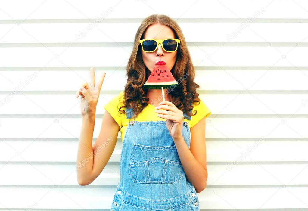Fashion cool girl eating a slice of watermelon in the form of ic