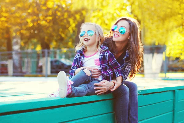 Happy smiling mother with child daughter having fun together in — Stock Photo, Image