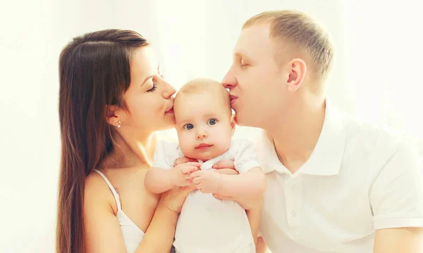 Portrait closeup happy family, mother and father kissing baby — Stock Photo, Image