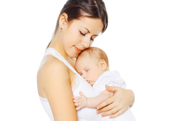 Portrait loving mother kissing her baby on a white background — Stock Photo, Image