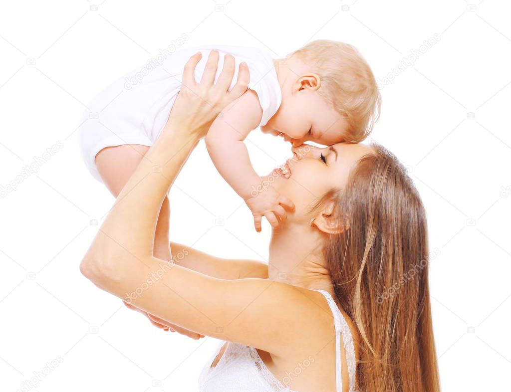 Happy smiling mother and baby having fun on a white background