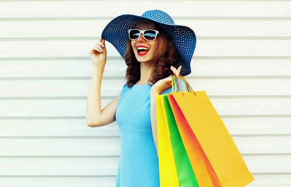 Portrait happy smiling woman with shopping bags wearing blue dre — 스톡 사진