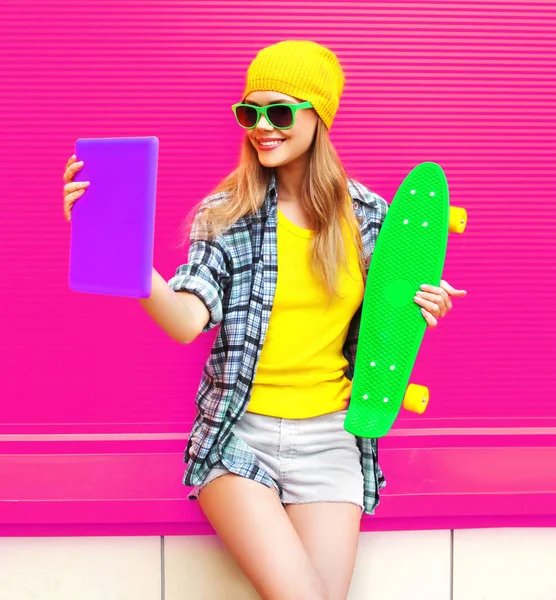 Cool smiling woman taking selfie picture by tablet pc with skate — 스톡 사진