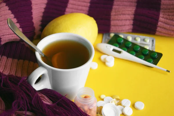 Assorted Pharmaceutical Medicine Pills Tablets Capsules Yellow Background Cup Tea — Stock Photo, Image