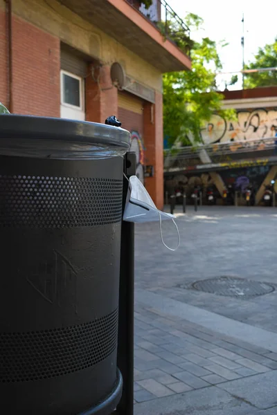 Dustbin in the city full of face masks during the coronavirus