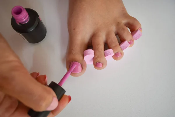 Female Foot Having Pedicure Putting Pink Nail Polish Nails Feet — Stock Photo, Image