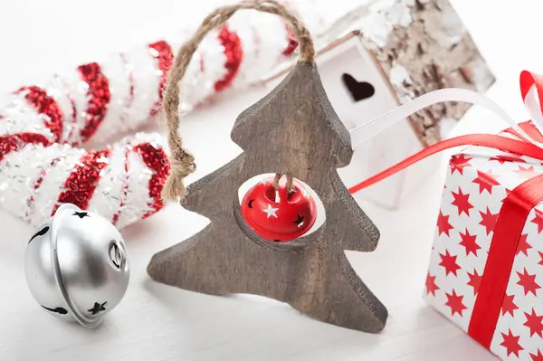 Christmas wooden tree with bell — Stock Photo, Image
