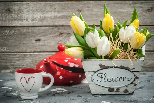 Tulips, cup and red polka dot teapot — Stock Photo, Image