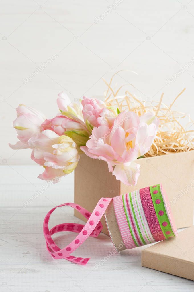 Fresh pink tulip flowers in gift kraft box