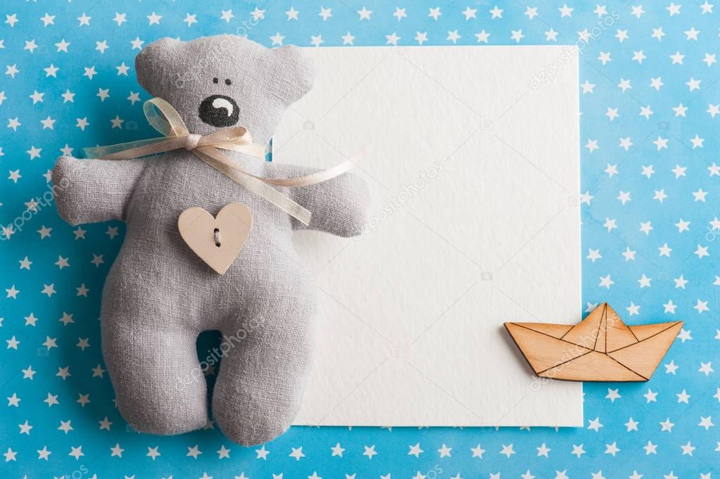 Blue white stars background with teddy bear 