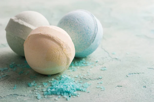 Bath bombs on blue concrete background — Stock Photo, Image