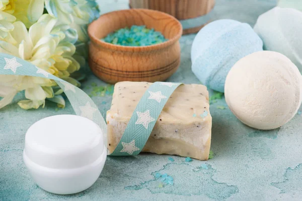 Bath salt, soap on blue concrete background — Stock Photo, Image